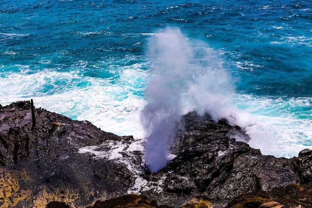 Surf spraying up through the Halona Blowhole